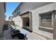 Cozy back patio with brick pavers, seating, and an awning, perfect for outdoor relaxation and enjoyment at 5805 W Warner St, Phoenix, AZ 85043