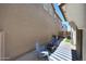 Inviting back patio with brick pavers, modern seating, a striped rug, and an outdoor fire pit at 5805 W Warner St, Phoenix, AZ 85043