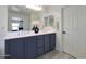 This bright bathroom offers a double vanity with neutral walls and sleek fixtures at 5805 W Warner St, Phoenix, AZ 85043