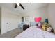 This bedroom is bright, offering neutral carpet and a sliding door closet at 5805 W Warner St, Phoenix, AZ 85043