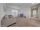 Bright bonus room is spacious with carpet floors and natural light from a window at 5805 W Warner St, Phoenix, AZ 85043