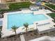 Aerial view of a spacious community pool surrounded by seating, landscaping, and recreational amenities at 5805 W Warner St, Phoenix, AZ 85043
