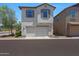 Two-story home boasts a neutral color scheme, a two-car garage, and neat landscaping for curb appeal at 5805 W Warner St, Phoenix, AZ 85043