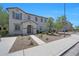 Inviting two-story home with a neutral palette, desert landscaping, and a welcoming entrance at 5805 W Warner St, Phoenix, AZ 85043