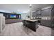 Open-concept kitchen featuring granite countertops, a kitchen island, and stainless steel appliances at 5805 W Warner St, Phoenix, AZ 85043