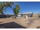 Spacious backyard with a fire pit and covered patio, perfect for outdoor entertaining at 643 N 92Nd Pl, Mesa, AZ 85207