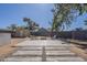 Spacious backyard featuring a fire pit area and additional outdoor seating, great for gatherings at 643 N 92Nd Pl, Mesa, AZ 85207