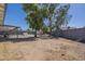Large backyard featuring a covered patio, storage shed, and ample space for recreation at 643 N 92Nd Pl, Mesa, AZ 85207