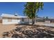A view of the backyard and covered patio, ideal for relaxation and outdoor living at 643 N 92Nd Pl, Mesa, AZ 85207
