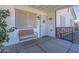 Cozy front porch with seating and decorative details welcomes you home at 643 N 92Nd Pl, Mesa, AZ 85207