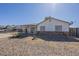 Well-maintained single-story home with desert landscaping and a covered front entry at 643 N 92Nd Pl, Mesa, AZ 85207