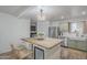 Bright kitchen with stainless appliances, stylish island, and wooden countertops provides a modern aesthetic at 643 N 92Nd Pl, Mesa, AZ 85207