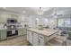 Open concept kitchen with stainless steel appliances, wood countertops, and a view into the living room at 643 N 92Nd Pl, Mesa, AZ 85207