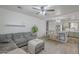 Open-concept living area with a modern kitchen and dining area, perfect for entertaining at 643 N 92Nd Pl, Mesa, AZ 85207