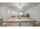 Bright open-concept kitchen and living room offers a welcoming and spacious living area at 643 N 92Nd Pl, Mesa, AZ 85207