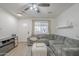 Cozy living area featuring laminate floors, a comfortable sofa, and neutral decor at 643 N 92Nd Pl, Mesa, AZ 85207
