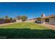Expansive backyard offering ample space for activities, framed by lush green grass at 656 E Mesquite Ave, Apache Junction, AZ 85119