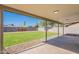 Lush backyard showcasing a pristine lawn and paved patio space at 656 E Mesquite Ave, Apache Junction, AZ 85119