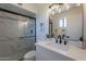 Elegant bathroom with white marble, a glass shower, modern fixtures, and a sleek vanity at 656 E Mesquite Ave, Apache Junction, AZ 85119
