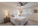 Comfortable bedroom with plush carpeting, a large window, and neutral-toned decor at 656 E Mesquite Ave, Apache Junction, AZ 85119