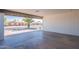 Covered carport area with a view of a quiet residential street and well-maintained homes at 656 E Mesquite Ave, Apache Junction, AZ 85119