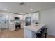 Beautiful kitchen featuring stainless steel appliances, a breakfast bar, light countertops and abundant cabinet space at 656 E Mesquite Ave, Apache Junction, AZ 85119