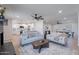 Bright, open living space with contemporary furnishings, fireplace, and seamless flow to the modern kitchen and dining area at 656 E Mesquite Ave, Apache Junction, AZ 85119
