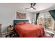 Comfortable bedroom with a large bed and sliding glass doors to outdoor area at 6739 N 16Th St # 14, Phoenix, AZ 85016