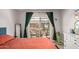 Bright bedroom with sliding glass doors to patio and outdoor seating area at 6739 N 16Th St # 14, Phoenix, AZ 85016