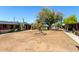 Well-maintained community common area with mature trees, cactus, lawn and nearby apartments at 6739 N 16Th St # 14, Phoenix, AZ 85016