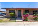 Charming single-story home with brick facade, flowering bushes, and a covered entry, showcasing curb appeal at 6739 N 16Th St # 14, Phoenix, AZ 85016