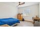 Bedroom with a ceiling fan and light wood-look floors at 7036 E Sheena Dr, Scottsdale, AZ 85254