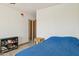 Bright bedroom with wood-look floors and closet at 7036 E Sheena Dr, Scottsdale, AZ 85254