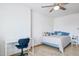 Well-lit bedroom featuring a ceiling fan and wood laminate flooring at 7036 E Sheena Dr, Scottsdale, AZ 85254