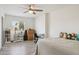 Bedroom with ceiling fan and light wood-look floors at 7036 E Sheena Dr, Scottsdale, AZ 85254