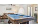 Inviting game room with pool table, comfortable couch, and a glimpse of the office at 7036 E Sheena Dr, Scottsdale, AZ 85254