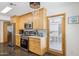 Kitchen with stainless steel appliances, wooden cabinets and a view to the patio at 7036 E Sheena Dr, Scottsdale, AZ 85254
