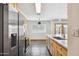 Kitchen featuring stainless steel appliances, wood cabinets and eat-in island at 7036 E Sheena Dr, Scottsdale, AZ 85254