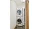 Laundry room with stacked washer and dryer at 7036 E Sheena Dr, Scottsdale, AZ 85254