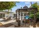 Backyard patio with a gazebo, lounge chairs, seating around the pool, and a fire pit at 7036 E Sheena Dr, Scottsdale, AZ 85254