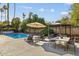 Relaxing backyard featuring a pool, lounge chairs, gazebo, and outdoor dining area at 7036 E Sheena Dr, Scottsdale, AZ 85254
