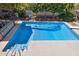 Aerial view of the outdoor pool with a bar area, basketball hoop and diving board at 7036 E Sheena Dr, Scottsdale, AZ 85254