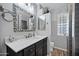 Bathroom with vanity, decorative mirror, tile accents, and shower for a spa-like experience at 7202 N 16Th Dr, Phoenix, AZ 85021