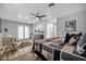 Bright bedroom boasts hardwood floors, ceiling fan, dresser and easy access to ensuite bathroom at 7202 N 16Th Dr, Phoenix, AZ 85021