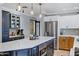 Open concept kitchen with a large island, stainless steel appliances, and modern pendant lighting at 7202 N 16Th Dr, Phoenix, AZ 85021