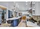 Spacious kitchen features a large island, stainless steel appliances, and stylish lighting fixtures at 7202 N 16Th Dr, Phoenix, AZ 85021