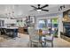 Charming eat-in kitchen with stainless appliances, island seating, and a view to the fireplace and outdoor patio at 7202 N 16Th Dr, Phoenix, AZ 85021