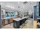 Spacious kitchen with island seating seamlessly blends with the dining area, creating an open and inviting atmosphere at 7202 N 16Th Dr, Phoenix, AZ 85021