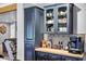Kitchen nook with custom cabinets, decorative tile backsplash, and a coffee bar with modern appliances at 7202 N 16Th Dr, Phoenix, AZ 85021