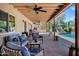 An expansive covered patio offers great views of the swimming pool and outdoor kitchen at 7202 N 16Th Dr, Phoenix, AZ 85021
